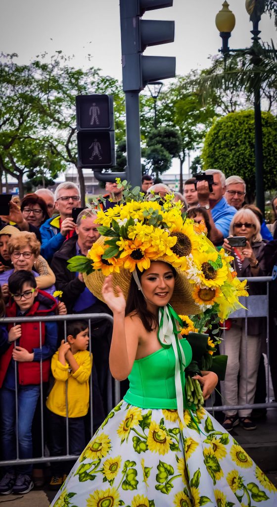 Woman wearing hat with flowers